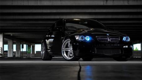 Sleek Black BMW in Urban Setting wallpaper