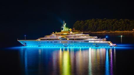 Majestic Superyacht Illuminated at Night wallpaper