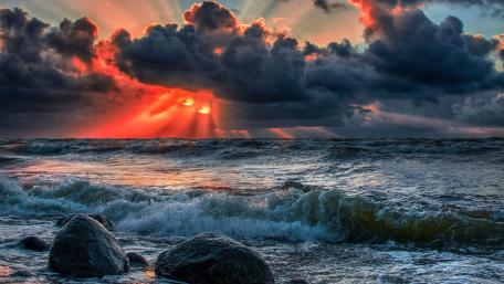 Dark Stormy Sea with Fiery Sunset wallpaper