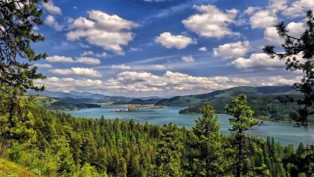 Serene River Valley Under a Vibrant Sky wallpaper