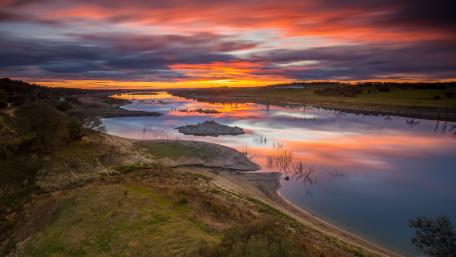 Serene Sunset Over Tranquil River Scene wallpaper