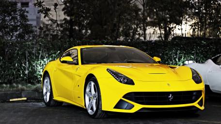 Vibrant Yellow Ferrari F12 Supercar Wallpaper wallpaper