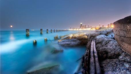 Serene Night by the Sea with Stumps wallpaper