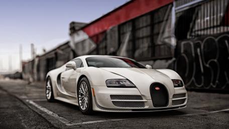 Luxury Speed Icon on Urban Streets wallpaper