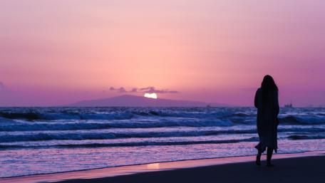 Serene Sunset Walk on the Beach wallpaper