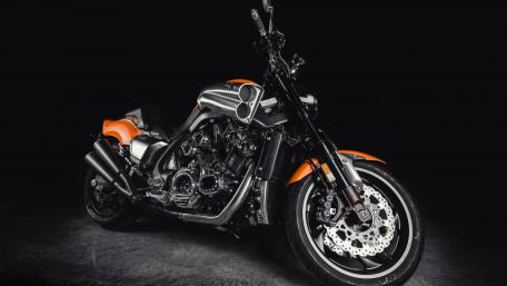 Sleek Black and Orange Motorcycle Wallpaper wallpaper