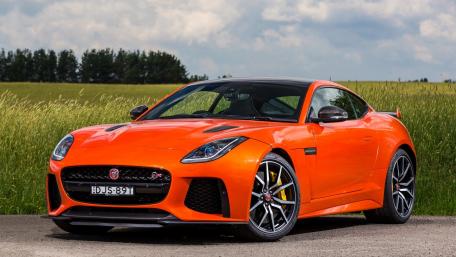 Vibrant Orange Jaguar F-Type Sports Car Wallpaper wallpaper