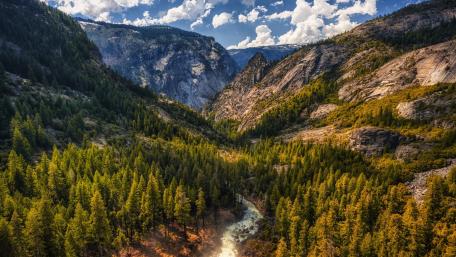 Valley Serenity Amidst Majestic Peaks wallpaper