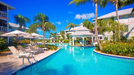 Tropical Paradise with Inviting Poolside Retreat wallpaper