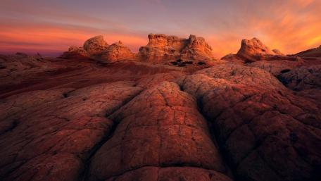 Stunning Badlands Sunset Over Rugged Terrain wallpaper