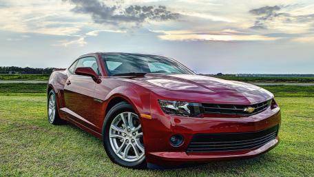 Sleek Chevrolet Camaro Against a Scenic Background wallpaper