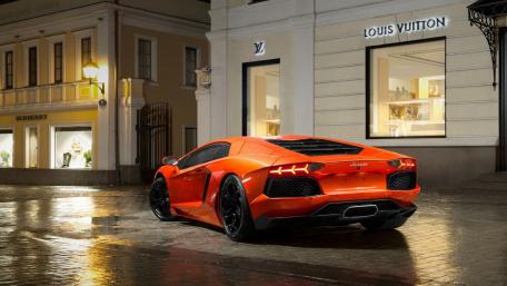 Vibrant Lamborghini Aventador in Stylish Urban Setting wallpaper