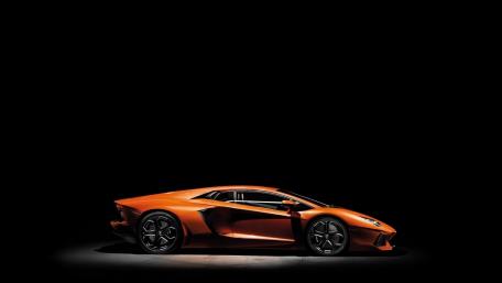 Sleek Lamborghini Aventador Against Black Background wallpaper