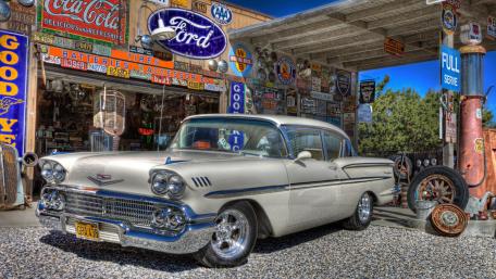 Classic Chevrolet at Vintage Petrol Station Scene wallpaper