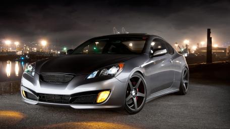 Sleek Hyundai Genesis Coupe in Night Cityscape wallpaper