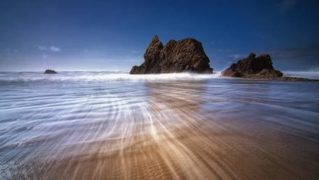 Serene Coastal Landscape with Rocks and Waves wallpaper