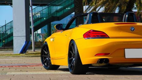 Vibrant BMW Convertible in Sunlit Setting wallpaper