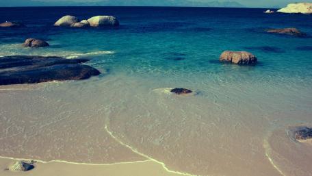 Serene Beach with Crystal Clear Waters wallpaper
