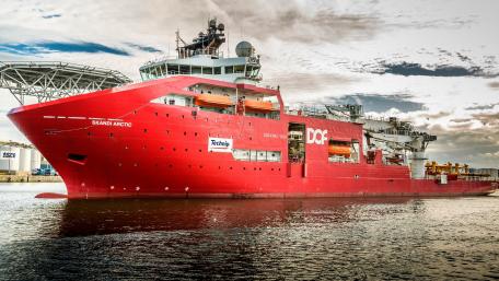 Vibrant Red Ship Docked at Port in 4K Quality wallpaper
