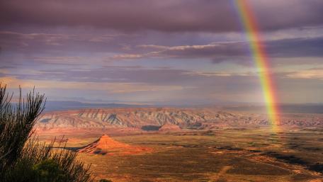 Vibrant Rainbow Over Majestic Landscape wallpaper