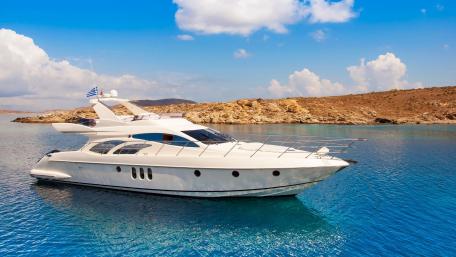 Elegant Yacht Amidst Serene Waters and Blue Skies wallpaper