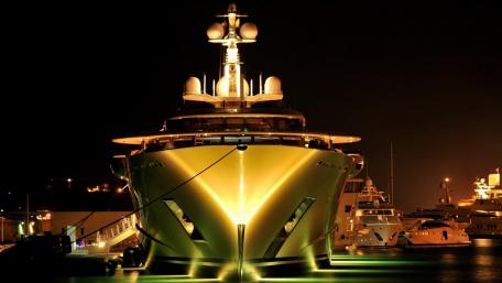 Elegant Superyacht Illuminated at Nighttime Harbor Scene wallpaper