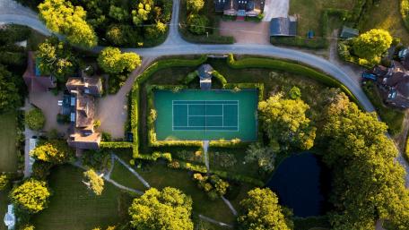 Serene Tennis Court in Lush Greenery wallpaper