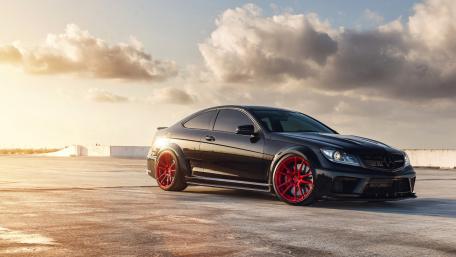 Sleek Black Mercedes with Bold Red Wheels wallpaper