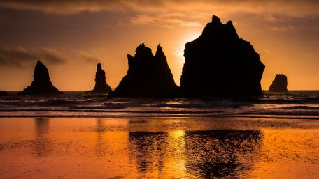 Majestic Sunset Over Serene Sea Stacks wallpaper