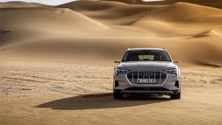 Sleek Audi e-tron in the Desert Landscape wallpaper