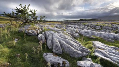 Serene Rocky Landscape under Expansive Sky wallpaper