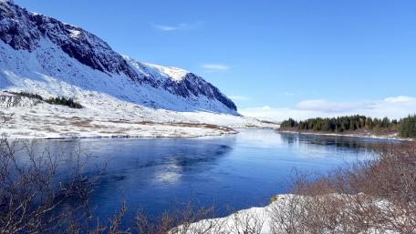 Serene Snowy River Landscape in 5K Resolution wallpaper