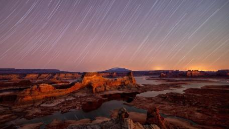 Celestial Dance Over Majestic Landscapes wallpaper