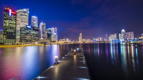 Vibrant City Lights Reflecting on Water wallpaper