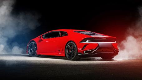 Vibrant Lamborghini Huracan Against a Dark Backdrop wallpaper