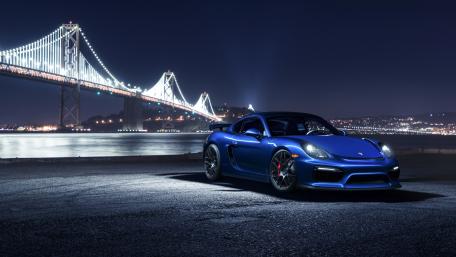 Sleek Blue Porsche at Night Under the Bridge wallpaper