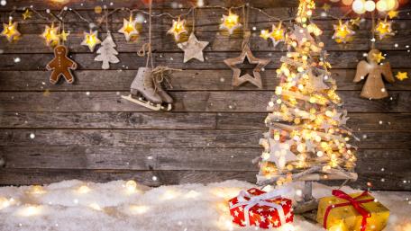 Festive Christmas Tree with Gifts and Lights in Winter Wonder wallpaper