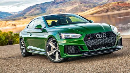 Sleek Audi RS5 Performance on the Open Road wallpaper