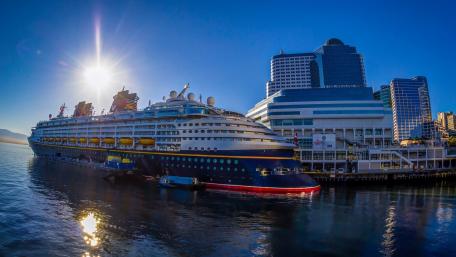 Majestic Cruise Ship at Port Under Golden Sunlight wallpaper