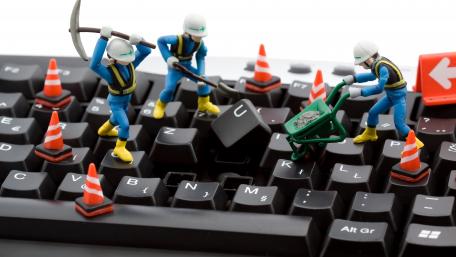 Tiny Technicians Tackling Keyboard Construction wallpaper