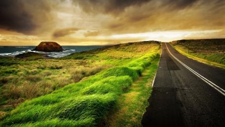 Serene Road by the Ocean at Dusk wallpaper