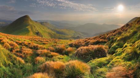 Majestic Mountain Landscape in Golden Light wallpaper