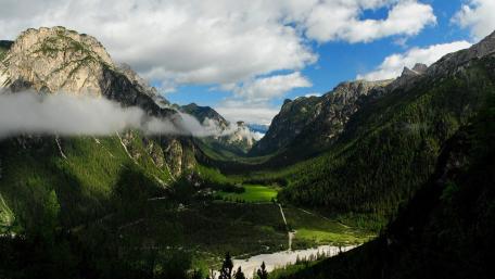 Majestic Valley Surrounded by Mountains wallpaper