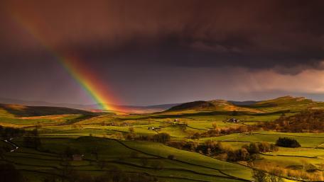 Rainbow Over Serene Landscape wallpaper