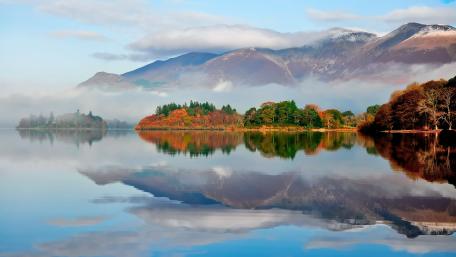 Serene Autumn Reflection Over a Tranquil Lake wallpaper