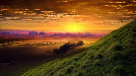 Serene Hillside Sunset Over Clouds wallpaper