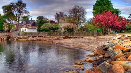 Charming Village by the Water in Springtime wallpaper