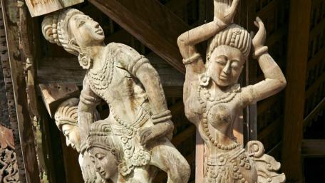 Elegant Wooden Statues Capturing City Culture wallpaper