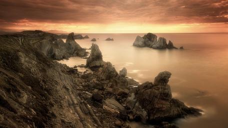 Serene Sepia Rocky Coastline Wallpaper wallpaper