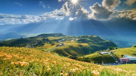 Breathtaking Sunlit Landscape with Majestic Rays of Light wallpaper